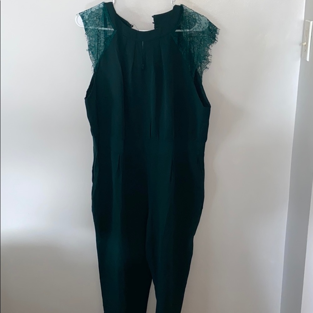 Women’s dark green romper, long pant.